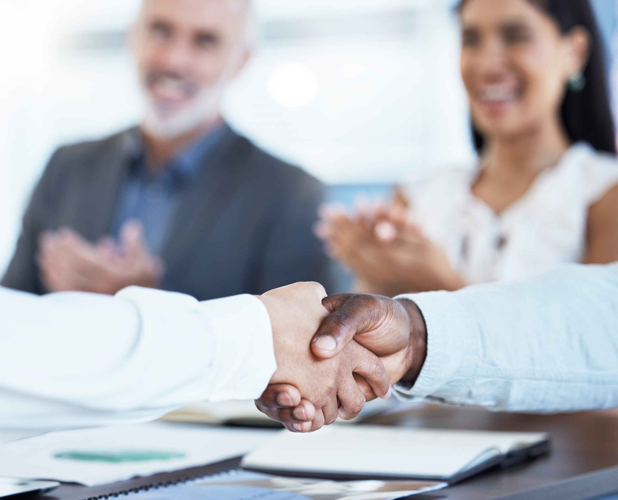 A business handshake symbolising the acquisition and investment deals typical in private equity.