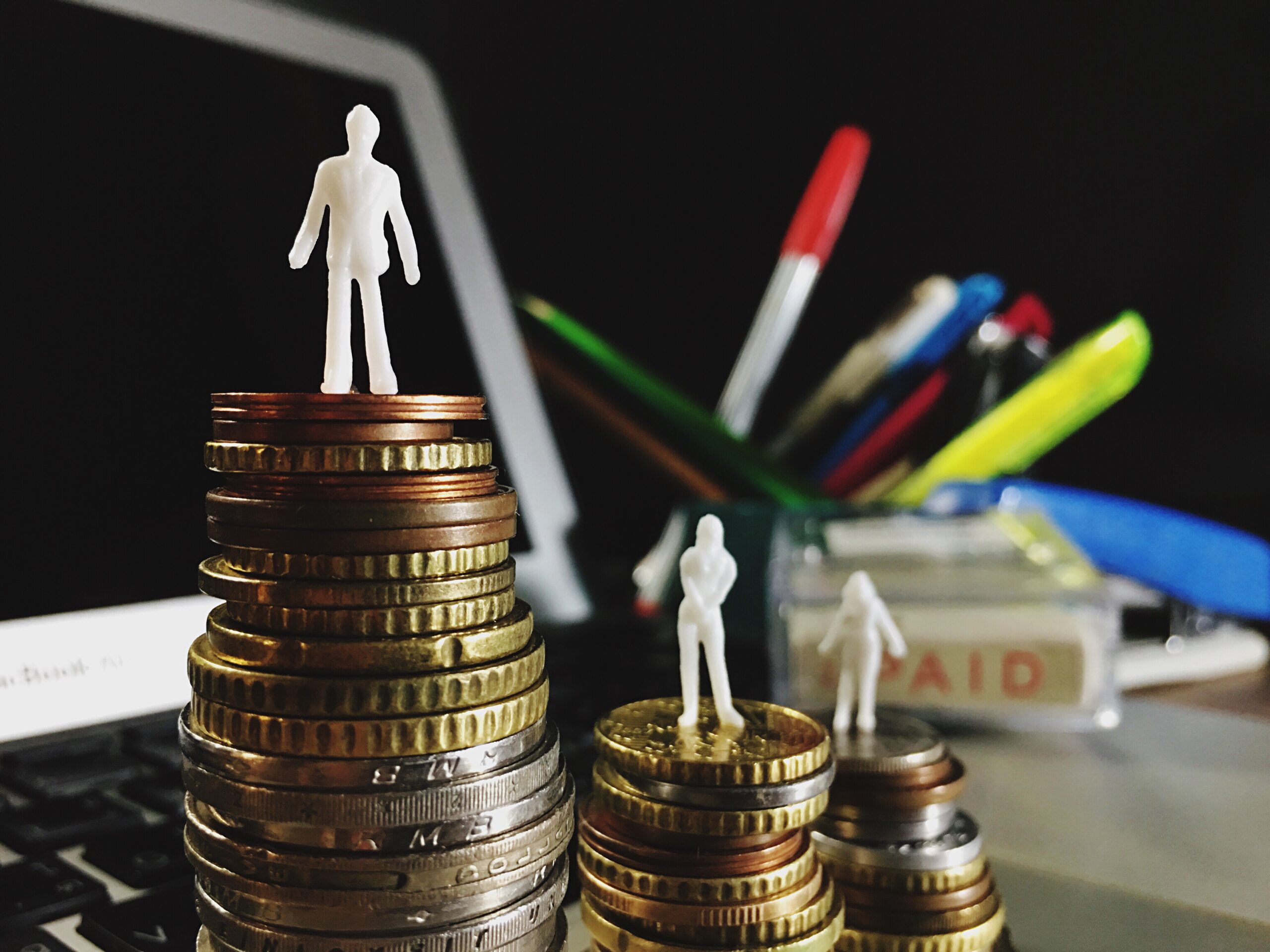 A stack of coins, representing different layers and types of capital involved in the capital stack for scaling businesses.